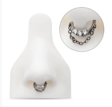 Titanio grado implante. Clicker con tres brillos clear y cadena