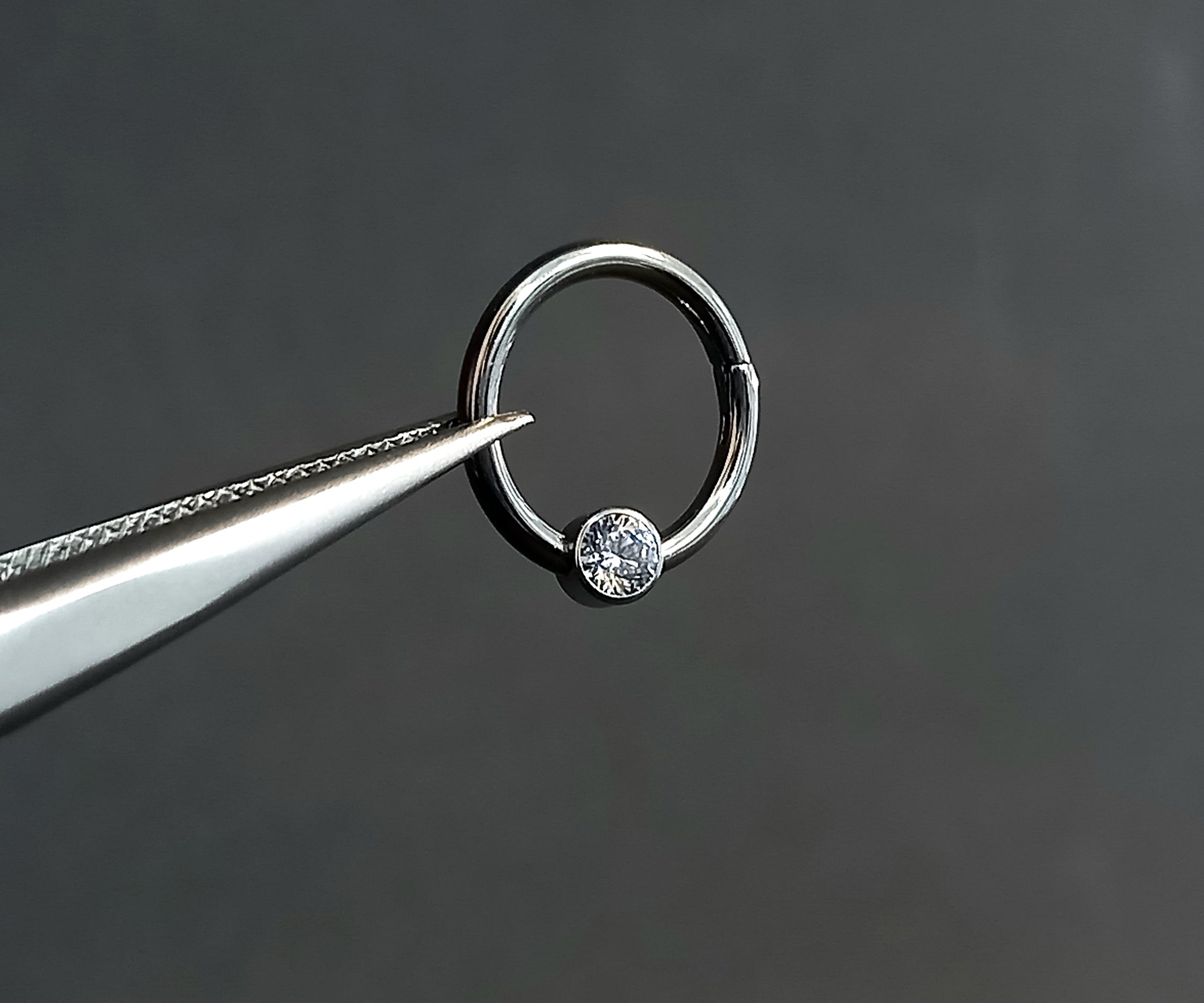 Argolla clicker brillo central clear