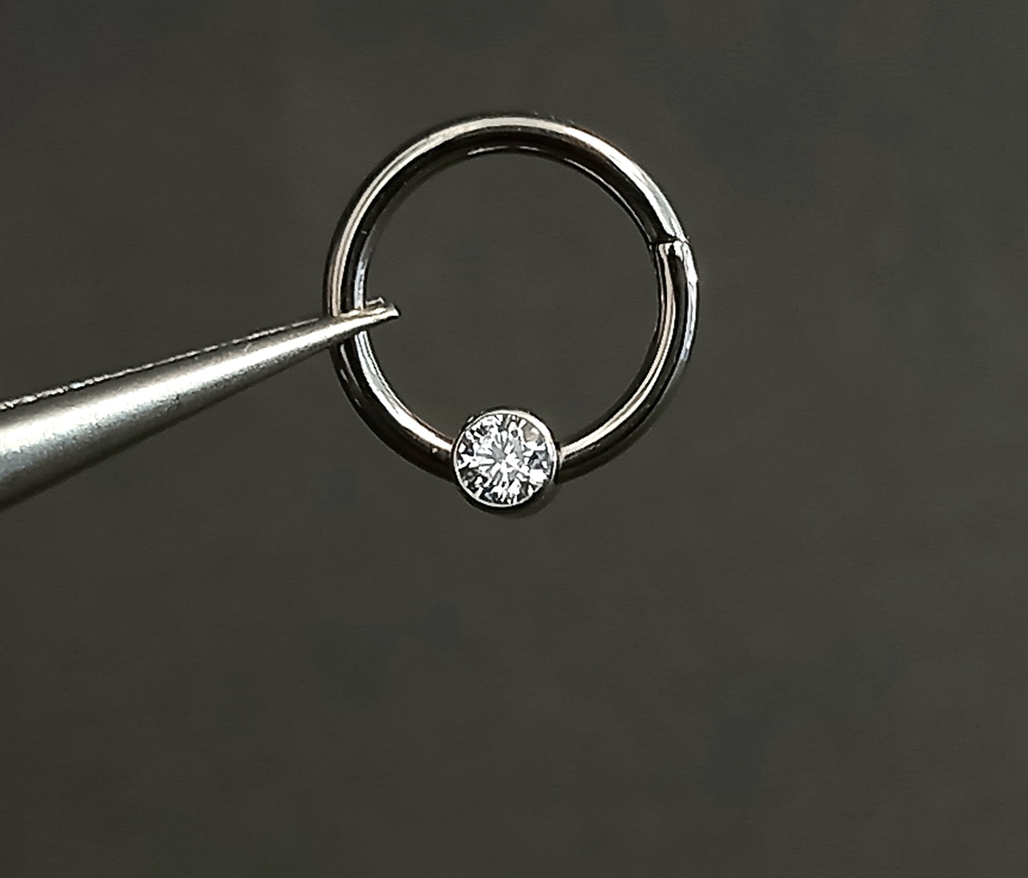 Argolla clicker brillo central clear