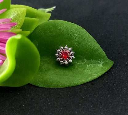 Titanio grado implante. Flor centro rojo