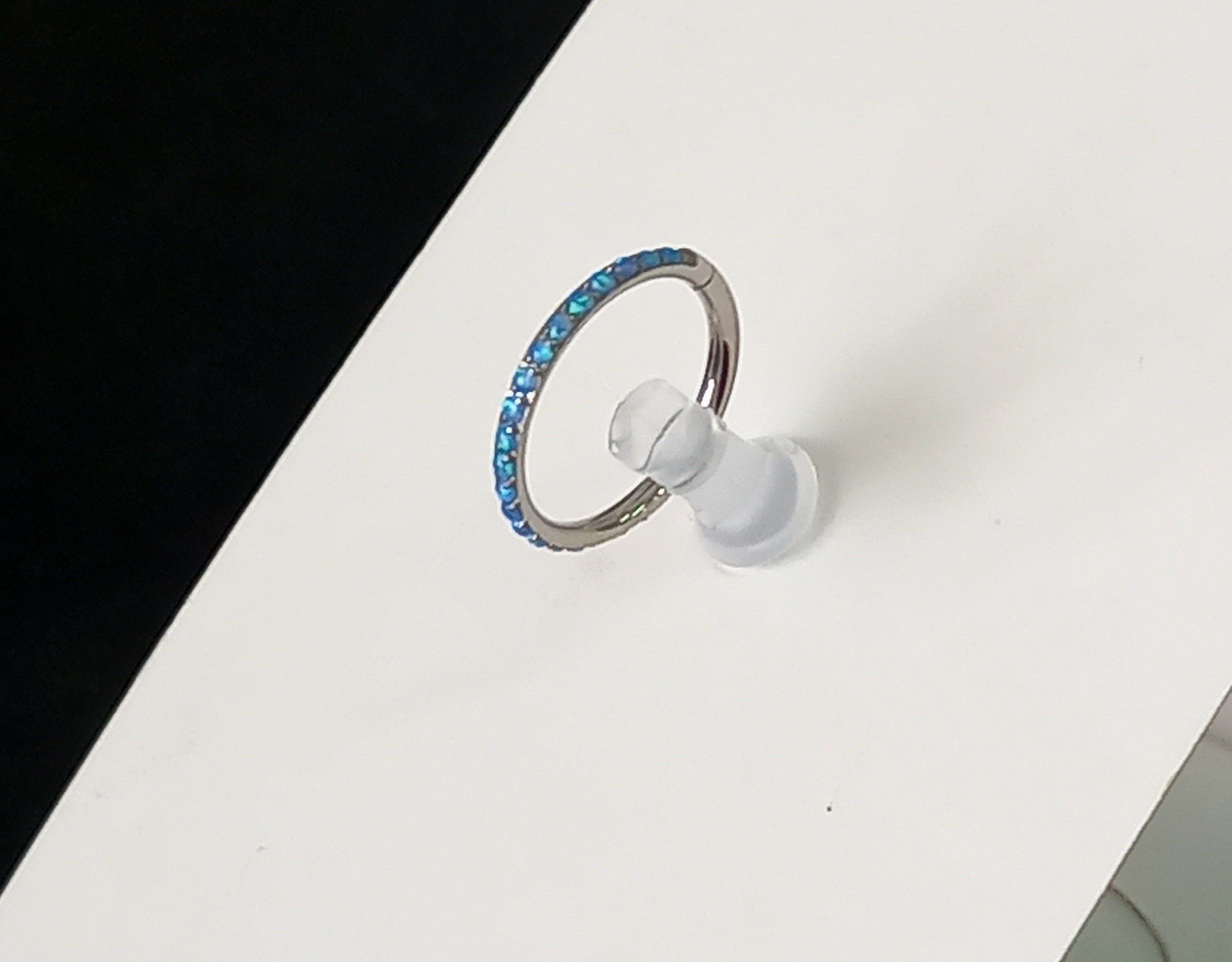 Argolla clicker ópalo lateral azul