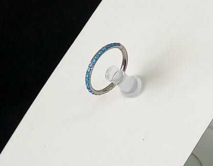 Titanio grado implante. Clicker opalo lateral azul