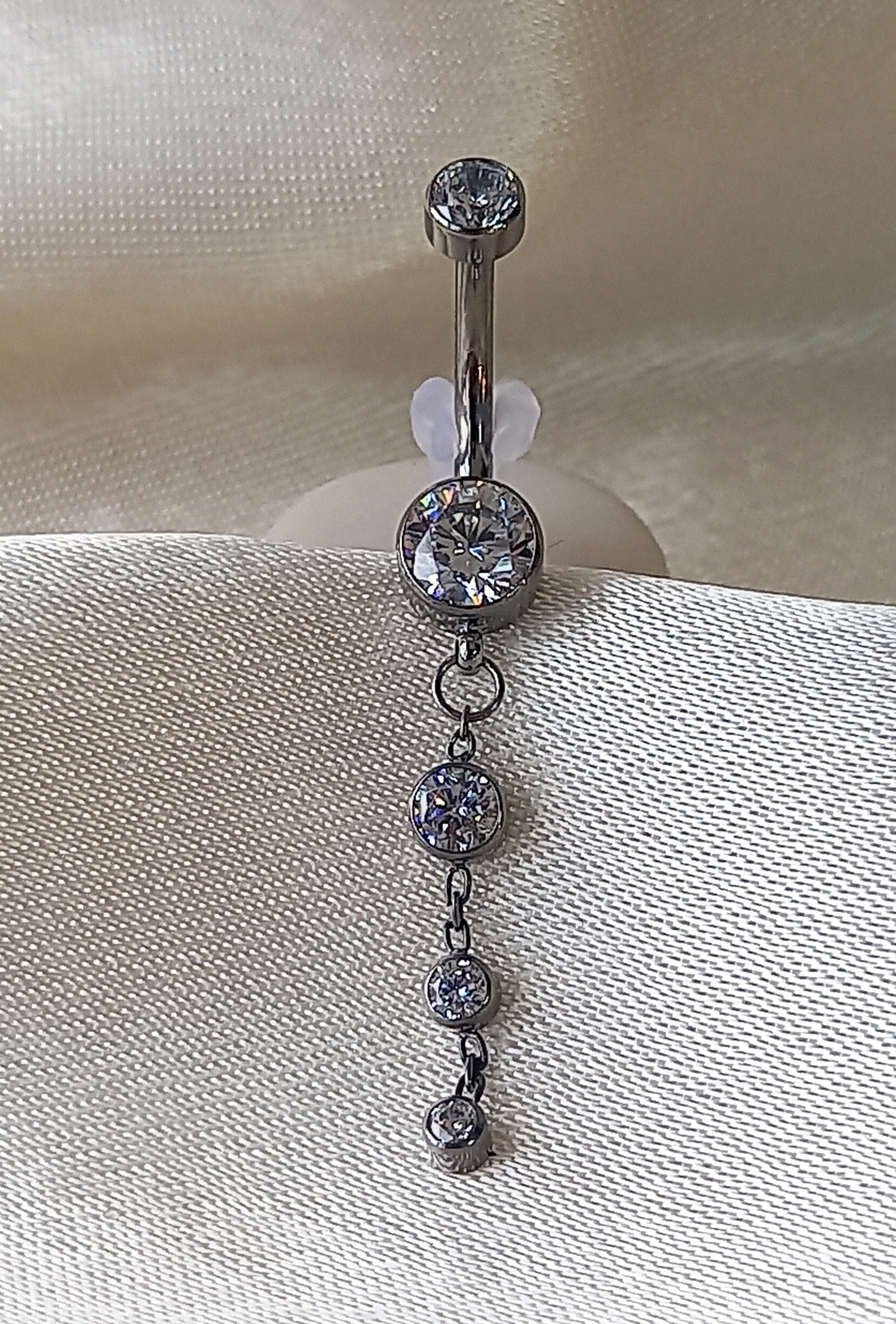 Navel tres brillos colgante