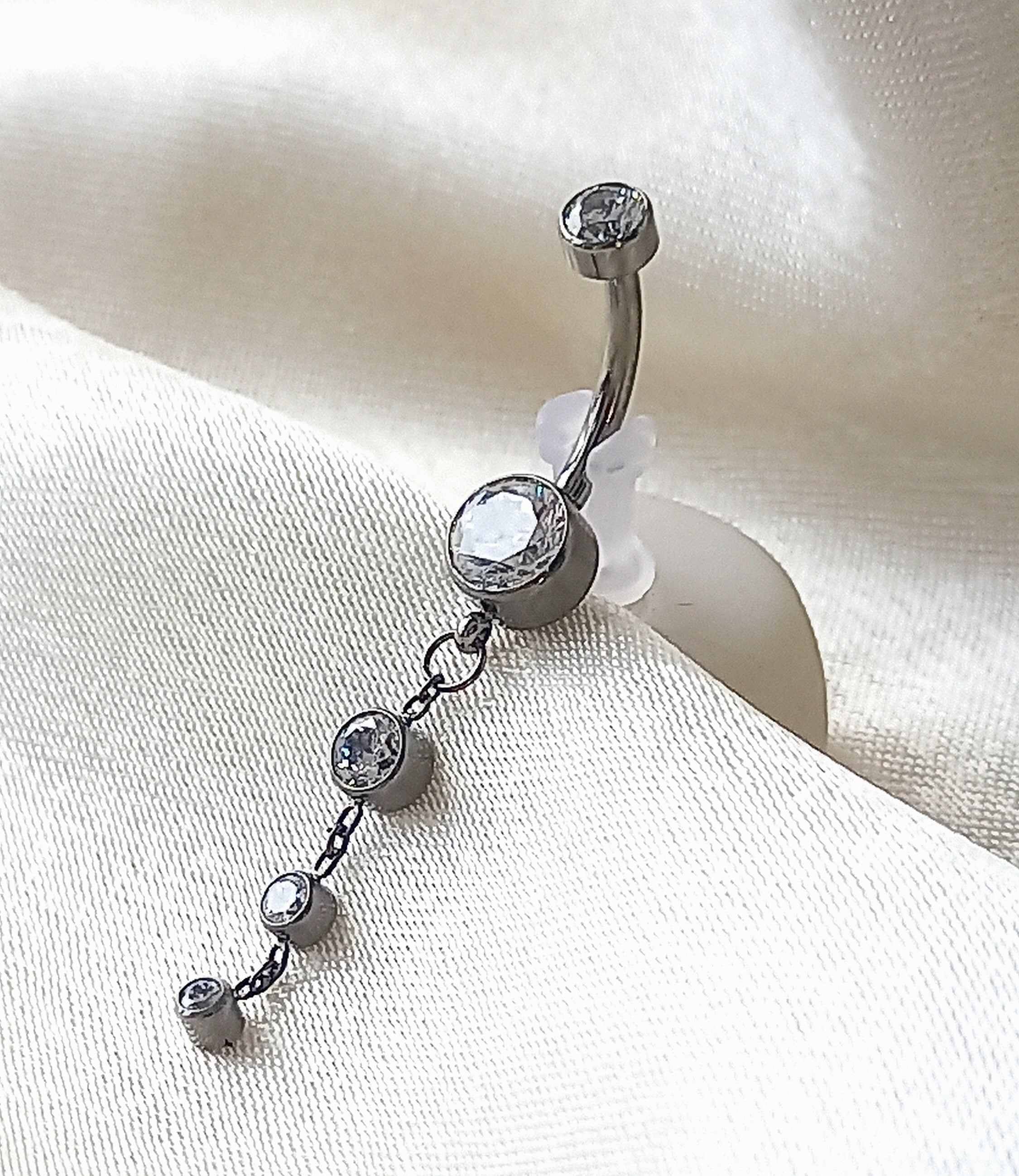 Navel tres brillos colgante