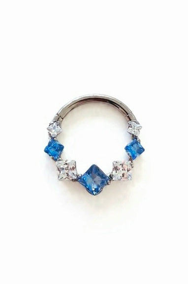Argolla clicker zircón con rombos azul y clear