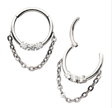 Titanio grado implante. Clicker con tres brillos clear  y cadena